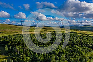 Aerial view of a small windfarm on a rural hillside