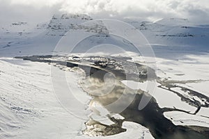 Aerial view of the snow-capped Mount Kirkjufell in early spring in Iceland.