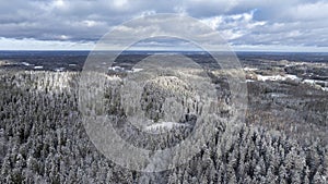 Aerial view of the snow-clad peaks and mosaic landscape of the Haanja upland, Voru county, Estonia