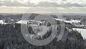 Aerial view of the snow-clad peaks and mosaic landscape of the Haanja upland, Voru county, Estonia