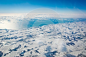 Aerial View of Snow covered Coastline