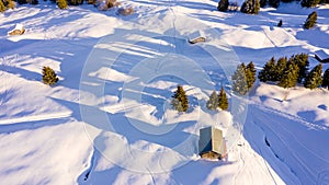 Aerial view of snow covered houses in small rural town in Switzerland