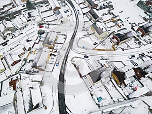 Aerial view of snow covered streets and roads during a blizzard (Wales