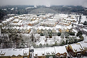 Aerial view snow fall on houses in Atlanta Georgia suburbs