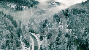 aerial view of snow mountain landscape with trees and road. Austria