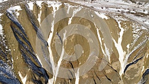 Aerial view on snow mountains. Epic alps panorama. Drone shot of Apline Mountains, Drone looks at rocky edge mountain