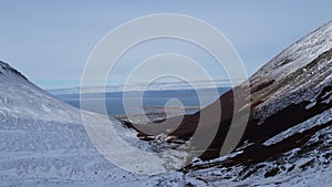 Aerial view of snow peaks emerges from the sea