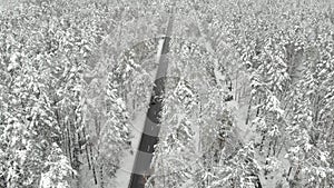 Aerial view of snowed up divided highway on a cloudy winter day