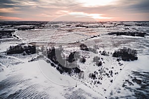 Aerial view of snowy countryside fields in Lithuania