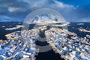 Aerial view of snowy fishing village in Norway in winter