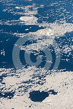 Aerial view of the snowy ice-covered landmass in Antarctica