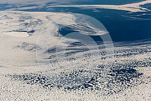 Aerial view of the snowy ice-covered landmass in Antarctica