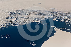 Aerial view of the snowy ice-covered landmass in Antarctica