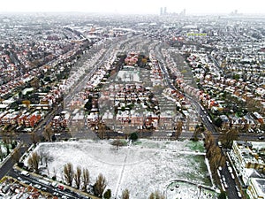 Aerial view of snowy London suburb in winter