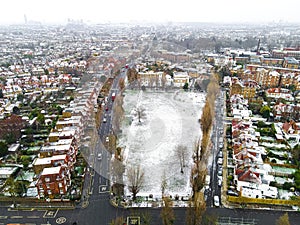 Aerial view of snowy London suburb in winter