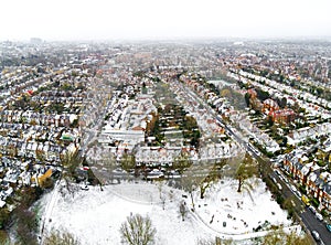 Aerial view of snowy London suburb in winter