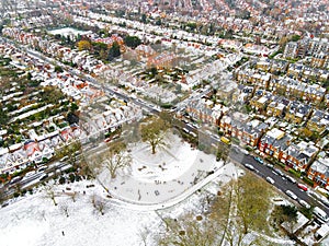 Aerial view of snowy London suburb in winter