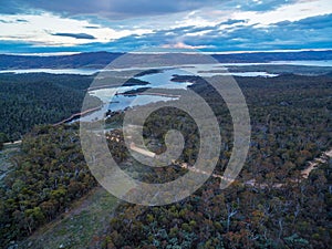 Aerial view of Snowy River flowing into Lake Jindabyne at sunset