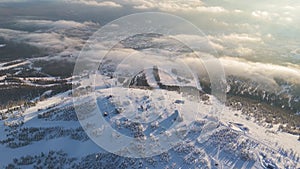 Aerial view snowy terrain with winter nature clouds embodying serene beauty Winter nature symbol majestic coldness snowy