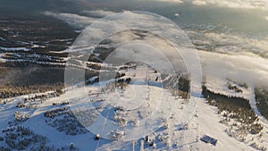 Aerial view snowy terrain with winter nature clouds embodying serene beauty Winter nature symbol majestic coldness snowy