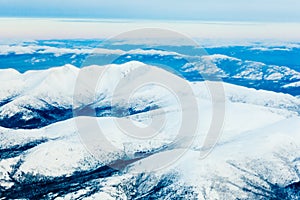 Aerial view of snowy winter mountains Yukon Canada