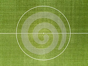 Aerial view of a soccer field made of artificial turf as background on the theme of football