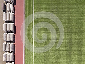 Aerial view of soccer stadium field. Top down drone shot.