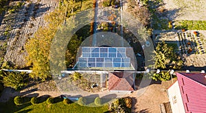 Aerial view of solar panals on the roof of small house