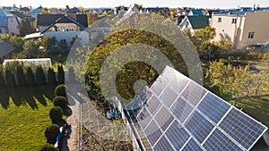 Aerial view of solar panals on the roof of small house