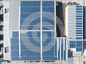 Aerial View of Solar Panel on Factory Rooftop, Solar energy electric panels creation on a storage building.