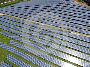 Aerial view of solar panels In the electric industry. Green energy that can be renewable for environment. Solar power alternative