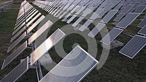 Aerial view of Solar Panels Farm solar cell with sunlight. Drone flying over solar panels factory.