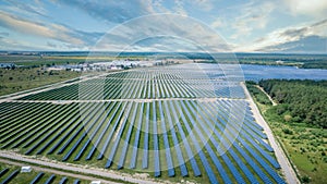 Aerial view of solar panels on green lawn. drone shot