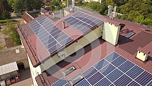Aerial view of solar panels on the roof of industrial building.