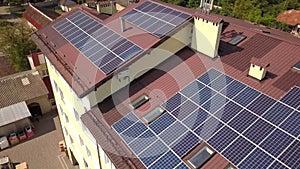 Aerial view of solar panels on the roof of industrial building.