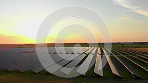 Aerial view of solar panels stand in a row in the fields power ecology innovation nature environment green energy