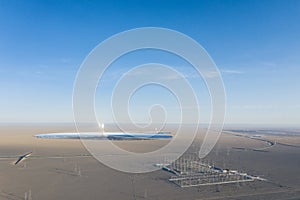 Aerial view of solar thermal power station and transformer substation on desert