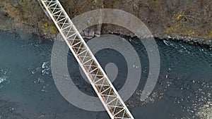 Aerial View of a Solitary Train Bridge Over a River