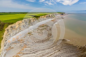 Aerial view of spectacular coastal limestone cliffs and ocean at Southerndown, Wales. UK