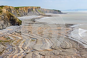 Aerial view of spectacular coastal limestone cliffs and ocean at Southerndown, Wales. UK