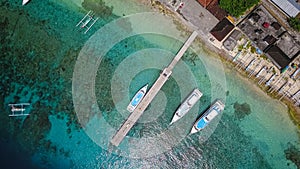 Aerial view of speed boat and beautiful sea beach at top view on summer, Luxury island paradise for tourism travel on