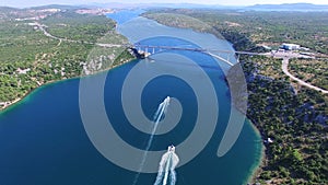 Aerial view of speedboats approaching bridge over dalmatian canal, Croatia