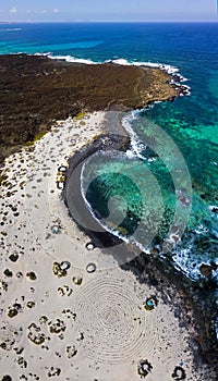 Aerial view of the Spiral Caleta, spiral beach, pebbles on the ground forming a spiral. Orzola, Lanzarote, Canary Islands, Spain