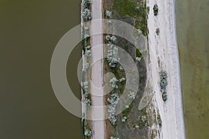 Aerial view of spit in river on cloudy day