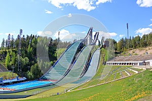 Aerial view of sports centre with three ski jump towers in the summer, Lahti, Finland