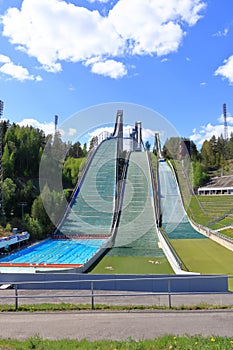 Aerial view of sports centre with three ski jump towers in the summer, Lahti, Finland