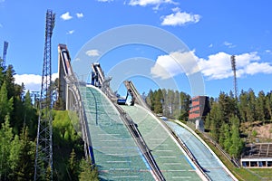 Aerial view of sports centre with three ski jump towers in the summer, Lahti, Finland