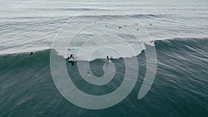 Aerial view of sportsmen surfing on the sea