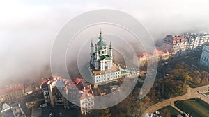 Aerial view of St. Andrew`s Church in heavy fog, Kiev, Ukraine