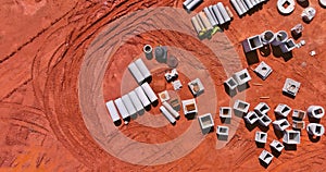 Aerial view stacked pipe at concrete drainage pipes for building with preparation land for construction site